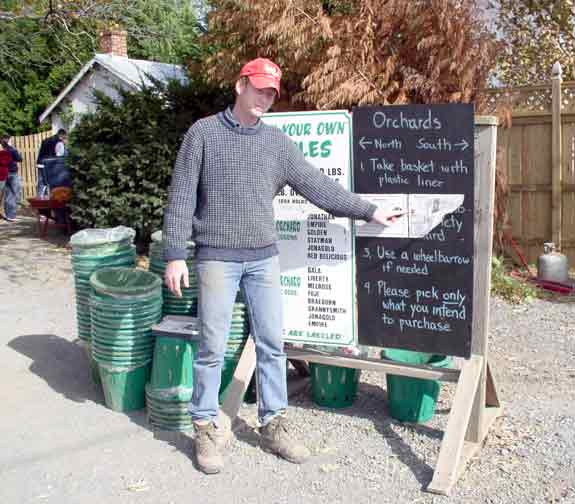 Todd shows people a orchard map