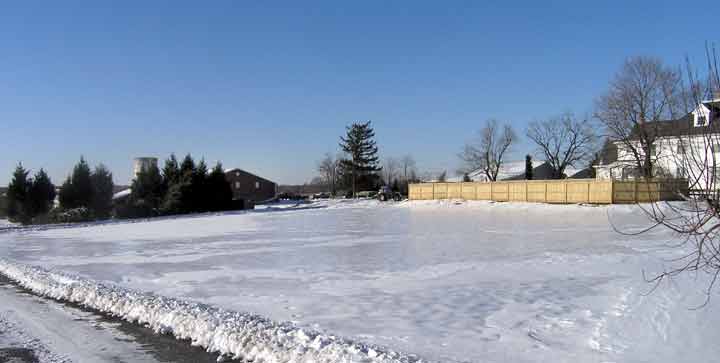 Snow covers the parking area.