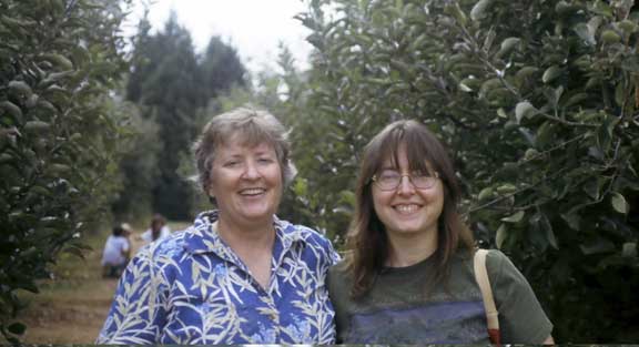 Anne and Suzanne in the apple orchard