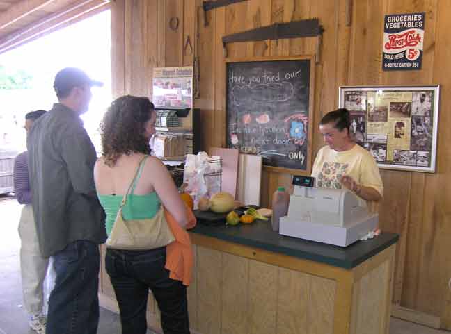 Cathy at the back register