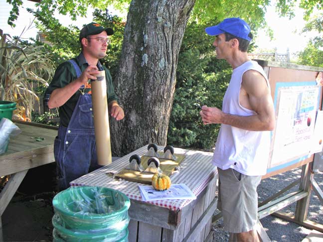 Sean greets customers and heads them to pick apples