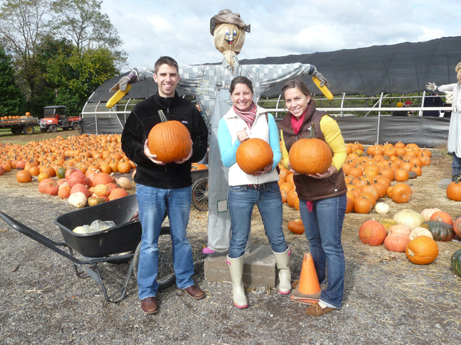 3 'kids' with pumpkins